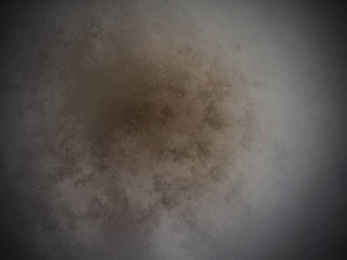 Siyah arkaplanın ortasında kahverengi bir madde.