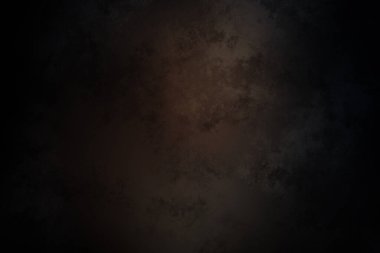 Siyah ve turuncu ışıklı koyu bir arka plan.