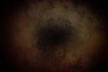 Karanlık bir arkaplanın ortasında bir kara delik.