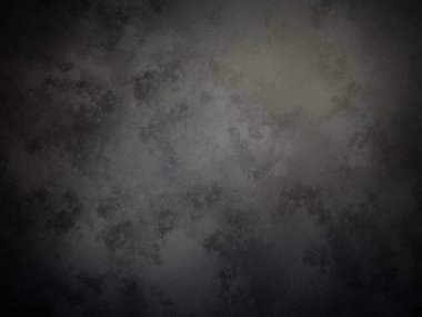 Siyah arka planı olan koyu gri bir duvar.
