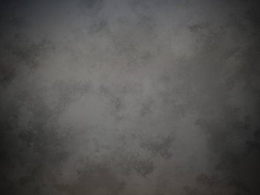 Koyu gri bir duvar ve soluk bir doku.