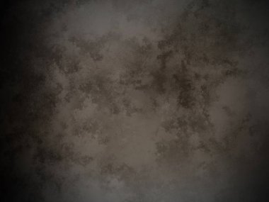 Koyu kahverengi bir arka plan ve pürüzlü bir doku.