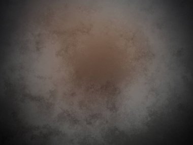 Siyah arkaplanın ortasında kahverengi bir çember.