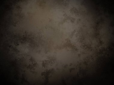 Koyu kahverengi bir arka plan ve pürüzlü bir doku.