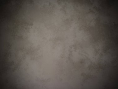 Koyu gri bir duvar ve beyaz bir nokta.