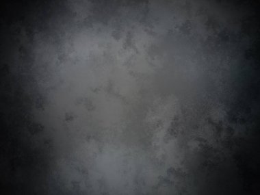 Koyu gri bir arkaplan ve pürüzlü bir doku