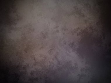 Beyaz kenarlı karanlık ve kirli bir duvar.