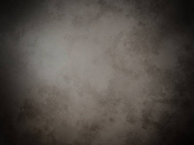 Karanlık ve kirli bir duvarın içinden bir ışık geliyor.