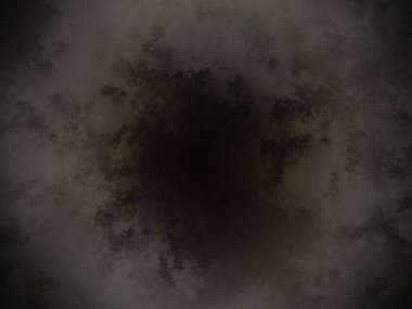 Bir kara deliğin siyah beyaz fotoğrafı.