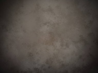 soluk yüzeyi olan koyu kahverengi bir arkaplan.