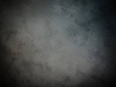 Koyu gri bir duvar ve soluk bir doku.