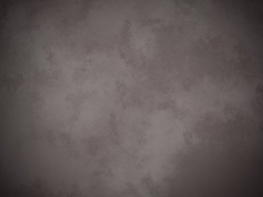 Beyaz kenarlı koyu gri bir duvar.