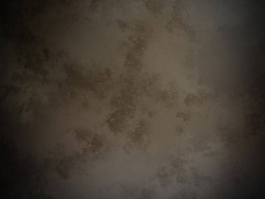 Koyu kahverengi bir duvar ve beyaz bir nokta.