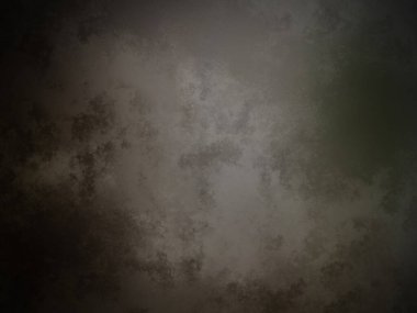 Üzerinde saat olan karanlık ve kirli bir duvar.