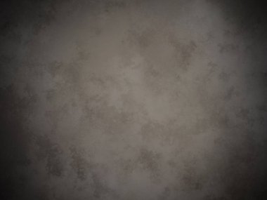 Koyu gri bir duvar ve beyaz bir nokta.