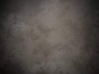 Koyu gri bir duvar ve beyaz bir nokta.