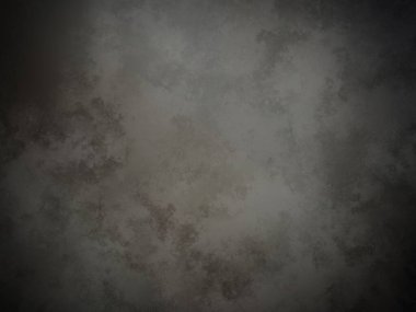 Koyu gri bir duvar ve beyaz bir nokta.