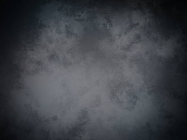 Koyu gri bir arkaplan ve soluk bir doku.