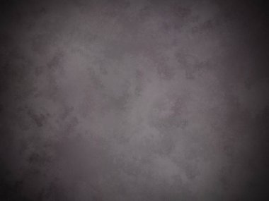 Beyaz kenarlı koyu gri bir duvar.