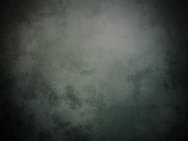 Koyu yeşil bir arkaplan ve soluk bir doku.