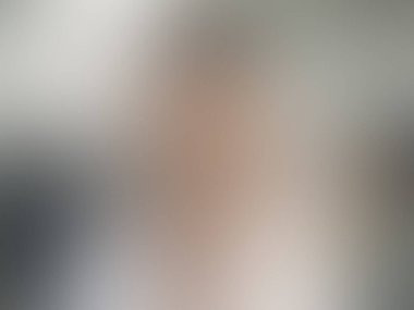 Açık gri vektör soyut bulanık arkaplan. Soyut ve gradyan renkte renkli çizimler. Tasarımlar için arkaplan.