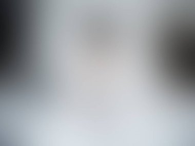 Modern gri ve beyaz rengin bulanık arkaplanı.