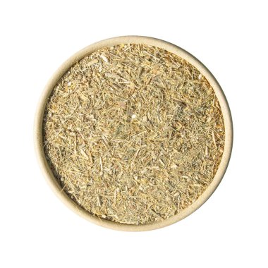 Beyaz kasede izole edilmiş yeşil buğday tohumları