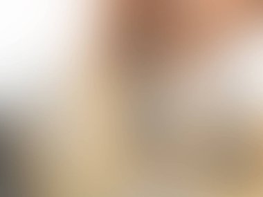 abstract pastel soft colorful smooth blurred textured background off focus toned in gold color