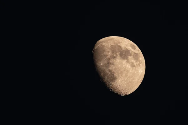 Detail or the Moon in a black scenery