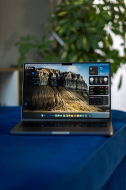 laptop computer with a black screen on a wooden table clipart