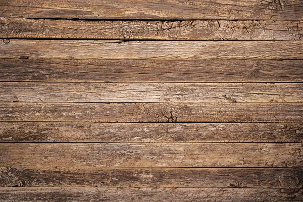 Rustic wood slat background,old and weather cracked wood,close up.