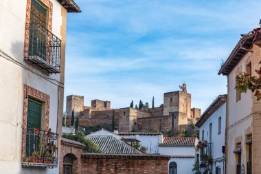 The Alhambra in Granada seen from a street in the Arab quarter of Albayzin.
