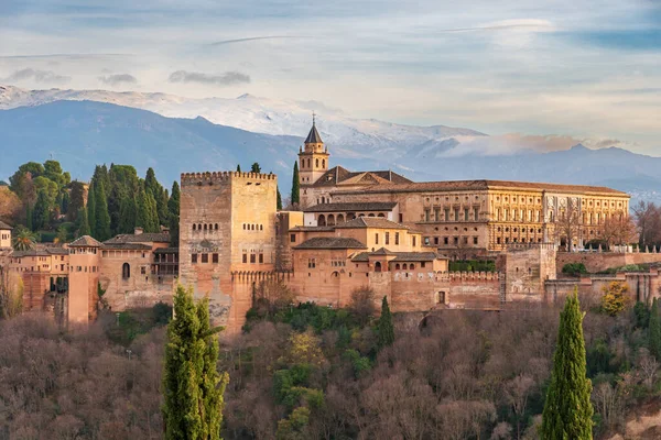 Palace of Carlos V in the Arab complex of the Alhambra in Granada, with Sierra Nevada in the background.