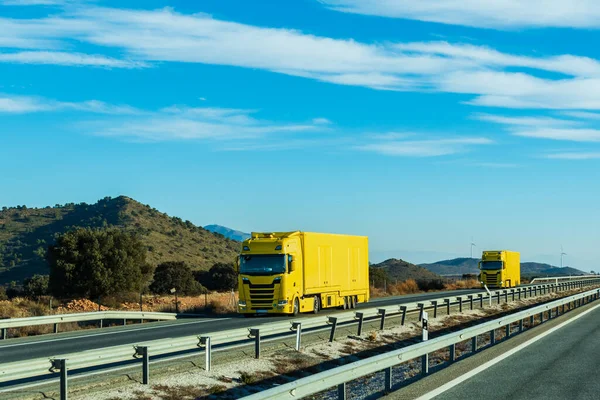 Two Trucks Yellow Trailers Driving Together Highway — Stock Photo, Image