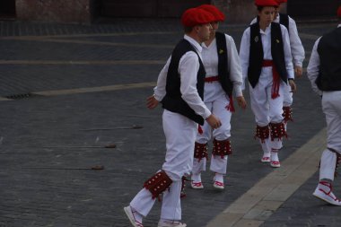 Basque folk dancers in a street festival in the old town of Bilbao, capital of Biscay, Basque province of Spain