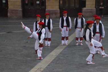 Basque folk dancers in a street festival in the old town of Bilbao, capital of Biscay, Basque province of Spain