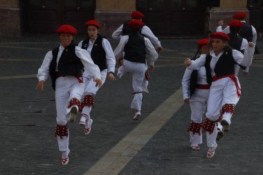 Basque folk dancers in a street festival in the old town of Bilbao, capital of Biscay, Basque province of Spain