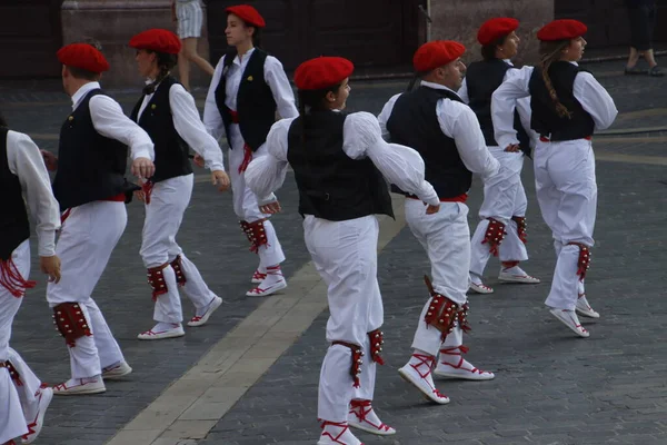 Basque folk dancers in a street festival in the old town of Bilbao, capital of Biscay, Basque province of Spain