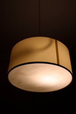 Lamp hanging from a ceiling clipart