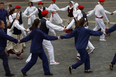 Basque folk dancers during a performance clipart