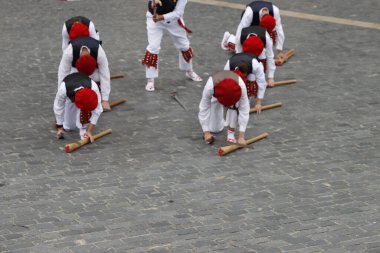 Basque folk traditional dance in a street festival clipart