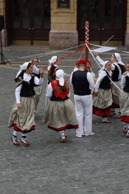 Basque folk dance performance in a street of Bilbao, Spain clipart