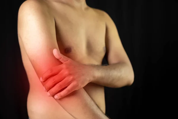 man fat have arm pain. hand holding arm. pain health therapy.