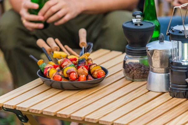 stock image barbeque and coffee equipment on table camping picnic. dinner summer party lifestyle. party weekend.