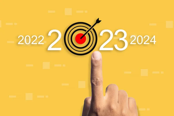 Hand point of pointing arrow target icon growth success business year 2022 to 2023 and 2024. planning for future of organization. successful customer service in company.