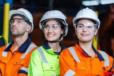 Close up women engineering wear uniform. Team engineering worker technician, workshop manufacturing, Teamwork in industry factory. group professional technician industrial.