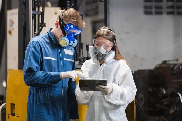 stock image Team inspector wearing chemical protective mask and hazmat suit examining chemistry in industrial. Analysing harmful substances to human body and environment. research working 