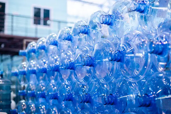 Plastic bottle for drinking water in production line of factory. Process of filling water into plastic bottles to bring out to consumers. gallon drink water manufacturing.