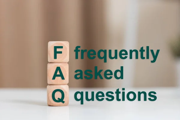 FAQ text (frequently asked questions), Text FAQ on wooden cube. Asking questions about various communication problems.