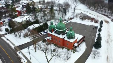 Guelph, Ontario, Canada- February 6, 2023: Aerial of a Ukrainian Catholic Church, St Mary's Parish Centre, Guelph, Canada 4K